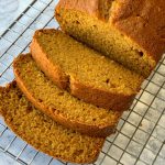 Sliced pumpkin spice bread on cooling rack