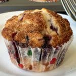 Beautiful blueberry muffin with cinnamon sugar topping on plate