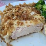 Slice of creamy pork chop casserole on a white plate