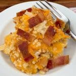 Cheesy bacon hashbrowns with fork