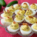 Bacon jalapeno deviled eggs in an egg tray