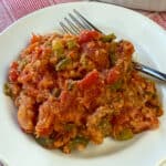 Tender breaded scalloped tomatoes with bread crumbs on a plate