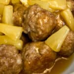 Close up moist meatballs with pineapple sweet and sour glaze