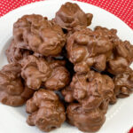 Plate of easy chocolate covered cherries with almonds