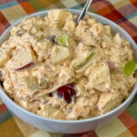 Crisp chunks of apples coated in a creamy pudding and Cool Whip mixture with marshmallows and peanuts to create a Caramel Apple Salad.