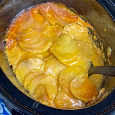 Close up of a golden brown finish over an easy recipe for crock pot potatoes.