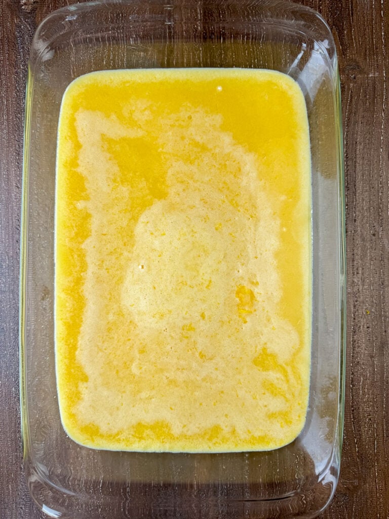 Egg and lemon mixture poured over top of a lightly baked crust to make lemon bars in a 9 x 13" pan.