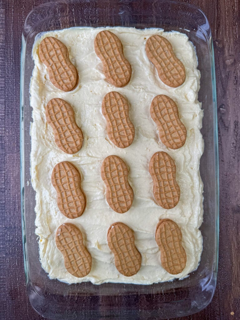 A few Nutter Butter cookies garnishing the top of a Nutter Butter banana pudding cheesecake.
