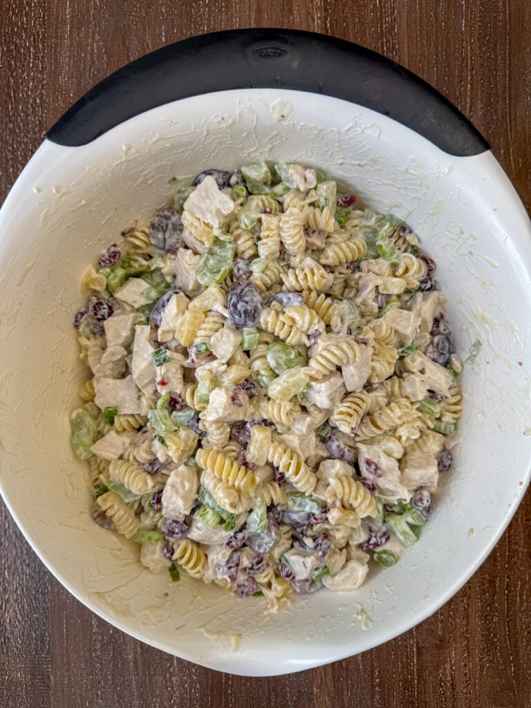 Simple creamy dressing stirred into a delicious cashew chicken pasta salad recipe.