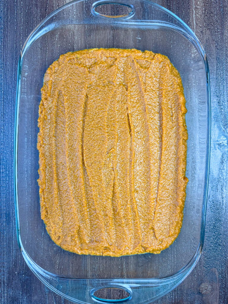 Pumpkin pie mix stirred into a box of cake mix and spread into a 9 x 13" pan.