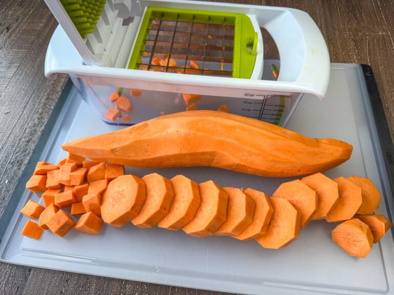Food chopper showing the easiest way to chop sweet potatoes into cubes with a whole potato, slices and cubes showing each step.